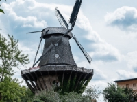 Historic Windmill  The windmill at Sanssouci Palace is among the best-known mills in Germany. Legend has it that Frederick the Great was bothered by the clatter of the windmill's sails and insisted that the miller, named Grävenitz, tear it down. The king acquiesced, however, when the miller threatened to take the case before the superior court of justice. The original post windmill from 1738 had to be torn down because of its dilapidated condition. It was replaced by a windmill based on a Dutch model. Although this structure was largely destroyed in World War II, the sails of the Historic Windmill of Sanssouci, visible from quite a distance, have been turning again since 1993. : 2016, Fujifilm, Potsdam, digital image, historia, history, kaupunki, kesäloma, matka, summer holiday, town, travel