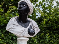 Black woman  A bust of a black woman in the park. She has very weirdly formed breast though. : 2016, Fujifilm, Potsdam, digital image, historia, history, kaupunki, kesäloma, matka, summer holiday, town, travel