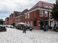 Dutch Quarter  The Dutch Quarter is equally popular with locals and visitors. It consists of 4 city blocks with about 150 red brick houses in a Dutch look – umplastered, with white joints, shutters and partially curved gables. This preserved architectural ensemble, unique in Europe, was built between 1734 and 1742 for Dutch workmen  who were brought to Potsdam by the Soldier King Frederick William I. Johann Boumann directed the building of the quarter. : 2016, Fujifilm, Potsdam, digital image, historia, history, kaupunki, kesäloma, matka, summer holiday, town, travel