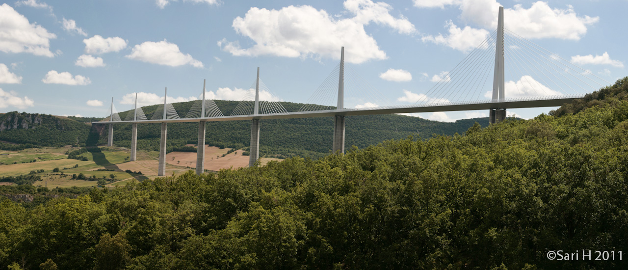 millau_pano_2.jpg - Millau viaduct  is a cable-stayed road-bridge that spans the valley of the river Tarn near Millau in southern France. Designed by the French structural engineer Michel Virlogeux and British architect Norman Foster, it is the tallest bridge in the world, with one mast's summit at 343.0 metres. It is the 12th highest bridge in the world, at 270 metres  high below the road deck.