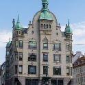 Højbrohus, Østergade 61, København (ca. 1896) by architect Richard Bergmann, and in front of the building is the Stork Fountain, a present to Crown Prince Frederik (later Frederik VIII) and Crown Princess Louise in connection with their silver wedding in 1894.