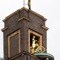 A female cyclist on weather tower