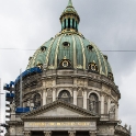 In many ways this landmark church is more richly decorated and impressive than Copenhagen's cathedral, Vor Frue Kirke. Instead of Frederikskirke, Danes often call this building Marmorkirken (Marble Church). Lying just a short walk from Amalienborg Palace, it began unsuccessfully in 1749. The original plan was to use "quarries" of expensive Norwegian marble.<br />The treasury dried up in 1770, and work came to a halt. It wasn't resumed until late in the 19th century when an industrialist, C. F. Tietgen, put up the money for its completion. This time a cheaper Danish marble was used instead. The original design was for neoclassical revival, but in the end the church was constructed in the Roman baroque style, opening in 1894. Inspired by Michelangelo's dome for St. Peter's in Rome, the Danish church was crowned with a copper dome, measuring 46m (151 ft.) high, making it one of the largest in the world.