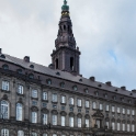 Christiansborg Palace on the islet of Slotsholmen is the seat of the Danish Parliament, the Danish Prime Minister's Office and the Danish Supreme Court. Also, several parts of the palace are used by the monarchy, including the Royal Reception Rooms, the Palace Chapel and the Royal Stables.<br />The palace today bears witness to three eras of Danish architecture, as the result of two serious fires. The first fire occurred in 1794 and the second in 1884. The main part of the current palace, finished in 1928, is in the historicist Neo-baroque style. The chapel dates to 1826 and is in a neoclassical style. The showgrounds were built 1738-46, in a baroque style.
