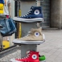 A pile of Converse shoes