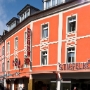 Hotel Mosser and Stiefelkönig shoe- and handbag store