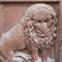A lion with a human face, part of a door