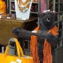 A bear selling handbags