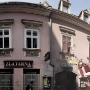 Speedy tourist passing old houses on Radiceva ulica