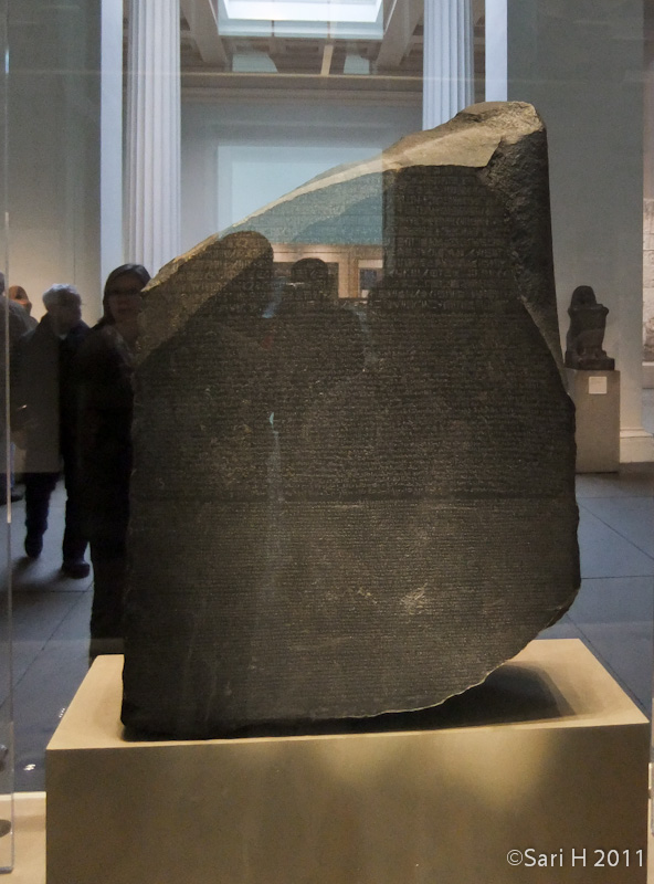 DSCF3203.jpg - The Rosetta Stone is an ancient Egyptian granodiorite stele inscribed with a decree issued at Memphis in 196 BC on behalf of King Ptolemy V. The decree appears in three scripts: the upper text is Ancient Egyptian hieroglyphs, the middle portion Demotic script, and the lowest Ancient Greek. Because it presents essentially the same text in all three scripts (with some minor differences between them), it provided the key to the modern understanding of Egyptian hieroglyphs. (Wikipedia)