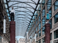 Standing on pole  Two figures on a pole inside a restaurant/mall area. : 2016, Berliini, Berlin, Fujifilm, Germany, Saksa, digital image, historia, history, kaupunki, kesäloma, matka, summer holiday, town, travel