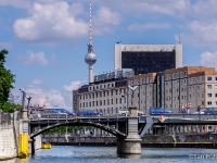 Biggest cross of East Berlin  When the sun shines on the Fernsehturm's tiled stainless steel dome, the reflection usually appears in the form of a cross. This effect was not anticipated by the architect. Berliners nicknamed the luminous cross Rache des Papstes, or the "Pope's Revenge". : 2016, Berliini, Berlin, Fujifilm, Germany, Saksa, digital image, historia, history, kaupunki, kesäloma, matka, summer holiday, town, travel