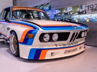 BMW 3.0 CSL  BMW 3.0 CSL, 1975. Initially using the same engine as the 3.0 CS, the 3.0 CSL was given a very small increase in displacement to 3,003 cc by increasing the engine bore by one quarter of a millimetre. This was done in August 1972 to allow the CSL to be raced in the "over three litre" racing category, allowing for some increase in displacement in the racing cars. In 1973, the engine in the 3.0 CSL was given another, more substantial increase in displacement to 3,153 cc by increasing the stroke to 84 mm. This final version of the 3.0 CSL was homologated in July 1973 along with an aerodynamic package including a large air dam, short fins running along the front fenders, a spoiler above and behind the trailing edge of the roof, and a tall rear wing. The rear wings were not installed at the factory, but were left in the boot for installation after purchase. This was done because the wings were illegal for use on German roads. The full aero package earned the racing CSLs the nickname "Batmobile". : 2016, BMW, BMW Museum, BMW Welt, Fujifilm, LG G3, Munich, München, car, digital image, historia, history, kesäloma, matka, motorbike, phone image, summer holiday, travel