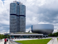 BMW Museum and headquarters  The BMW Museum is an automobile museum of BMW history located near the Olympiapark in Munich, Germany. The museum was established in 1973, shortly after the Summer Olympics opened. From 2004 to 2008, it was renovated in connection with the construction of the BMW Welt, directly opposite. The museum reopened on June 21, 2008. Known as the salad bowl or white cauldron, the silver futuristic building was designed by the architect of the BMW Headquarters, the Viennese professor Karl Schwanzer. The roughly circular base is only 20 meters in diameter, the flat roof about 40 metres.  BMW Headquarters (German: BMW-Vierzylinder "BMW four-cylinder"; also BMW Tower or BMW Hochhaus) is a Munich landmark which has served as world headquarters for the Bavarian automaker BMW for over 40 years. It was declared a protected historic building in 1999. Extensive renovations commenced in 2004 and were completed in 2006. The Tower was built between 1968 and 1972 and was ready in time for 1972 Summer Olympics. Its inauguration followed on 18 May 1973. The 101-metre (331 ft) building is located near the Olympic Village and is often cited as one of the most notable examples of architecture in Munich. : 2016, BMW, BMW Museum, BMW Welt, Fujifilm, LG G3, Munich, München, car, digital image, historia, history, kesäloma, matka, motorbike, phone image, summer holiday, travel