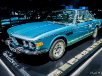 BMW 3.0 CSi  BMW 3.0 CSi  1971. The 2800CS was replaced by the 3.0 CS and 3.0 CSi in 1971. The engine had been bored out to give a displacement of 2,986 cc, and was offered with a 9.0:1 compression ratio, twin carburettors, and 180 horsepower (130 kW) at 6000 revolutions per minute in the 3.0 CS or a 9.5:1 compression ratio, Bosch D-Jetronic fuel injection, and 200 horsepower (150 kW) at 5500 revolutions per minute in the 3.0 CSi. There was a 4 speed manual and an automatic transmission variant. : 2016, BMW, BMW Museum, BMW Welt, Fujifilm, LG G3, Munich, München, car, digital image, historia, history, kesäloma, matka, motorbike, phone image, summer holiday, travel