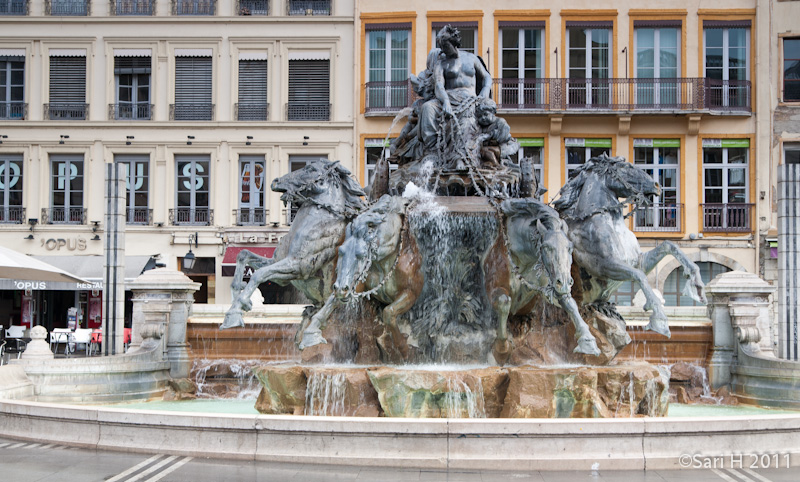 lyon-5.jpg - La Fontaine Bartholdi, the fountain sculpted by Frédéric-Auguste  Bartholdi, erected in 1892. The fountain depicts France as a female seated on a chariot controlling the four great rivers of France,  represented by wildly rearing and plunging horses.